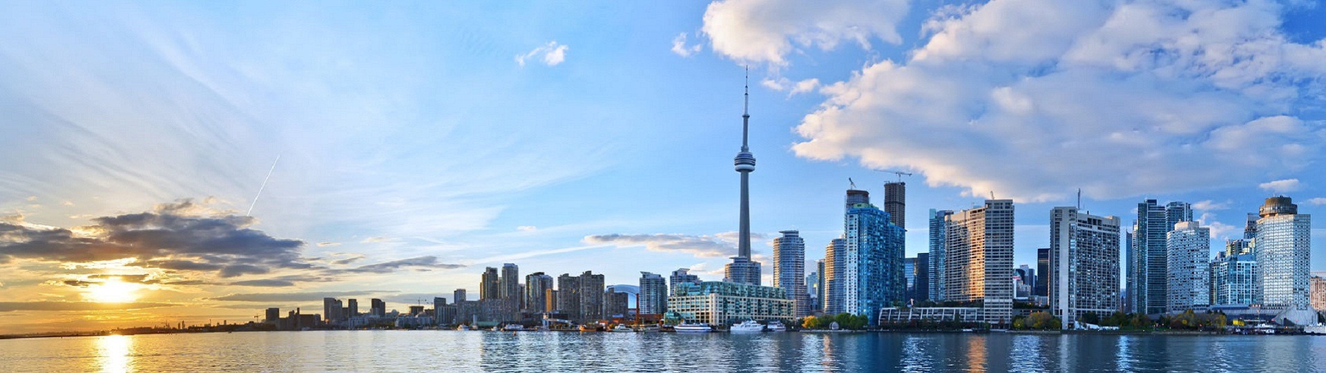 Panorama of Toronto skyline at sunset in Ontario, Canada.